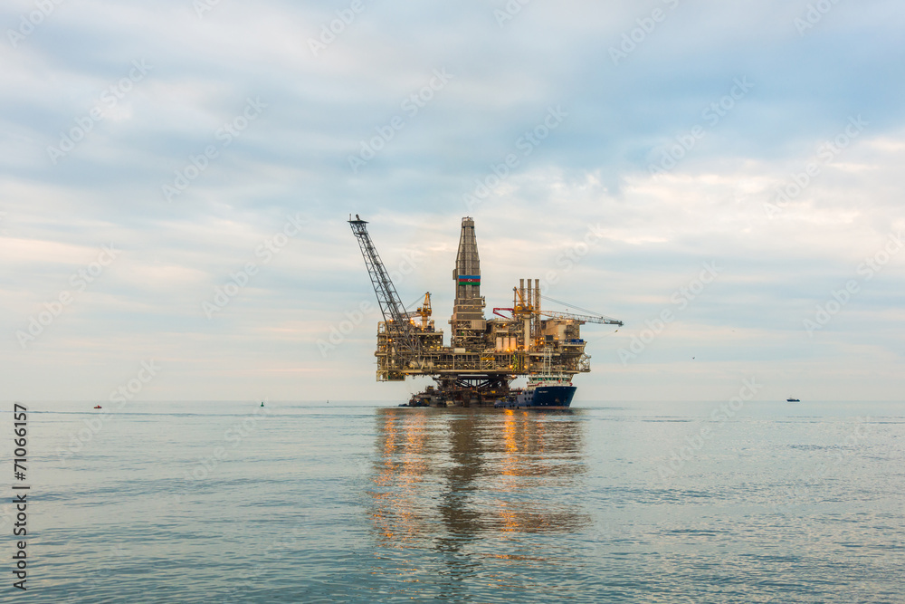 Oil rig platform in the calm sea Oil rig platform in the calm sea