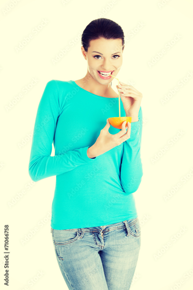 Young woman drinking orange juice Young woman drinking orange juice