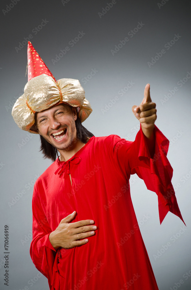 Fototapeta premium Funny wizard wearing red dress