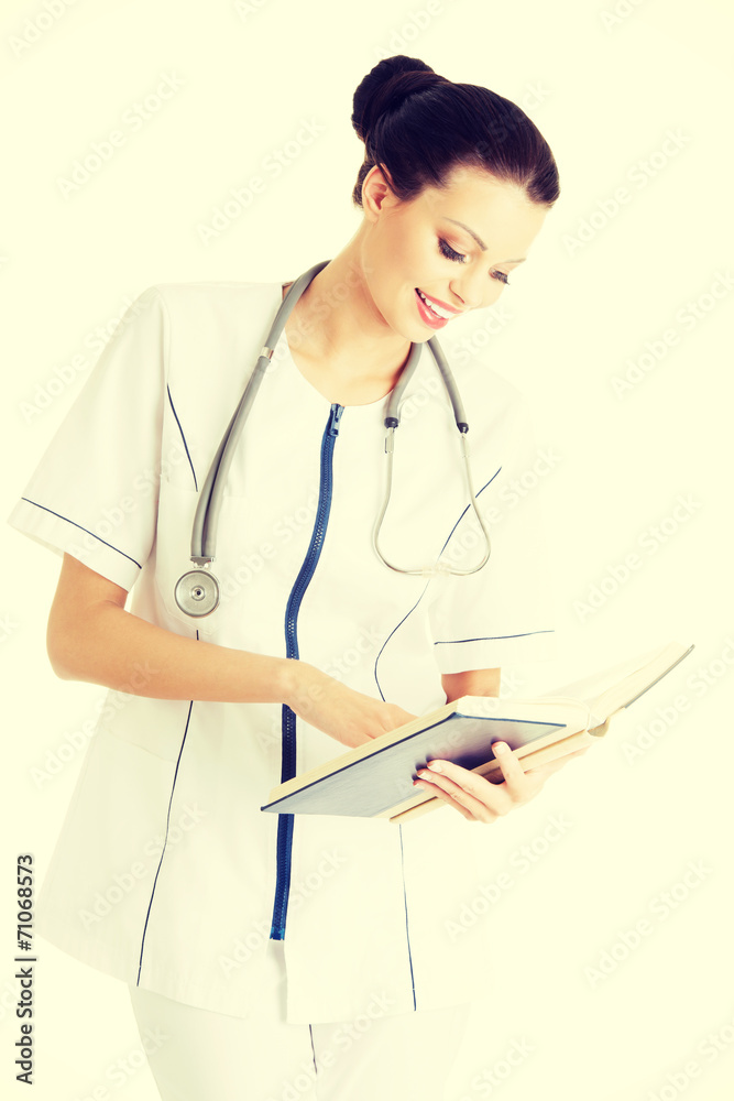 Attractive medicine student or doctor with book Attractive medicine student or doctor with book