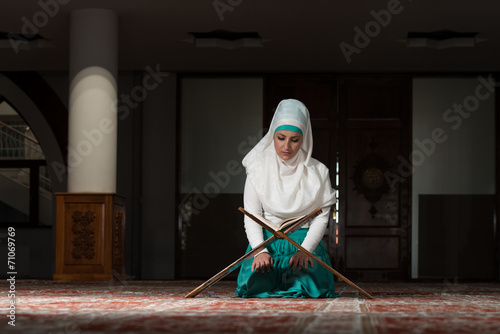 Muslim Woman Reading The Koran © Jale Ibrak