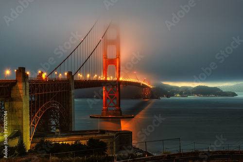 Golden Gate bridge at night, Illumination in fog, San Francisco, California.