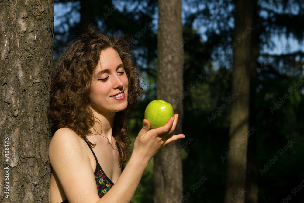 beautiful young woman eating apple outdoors beautiful young woman eating apple outdoors