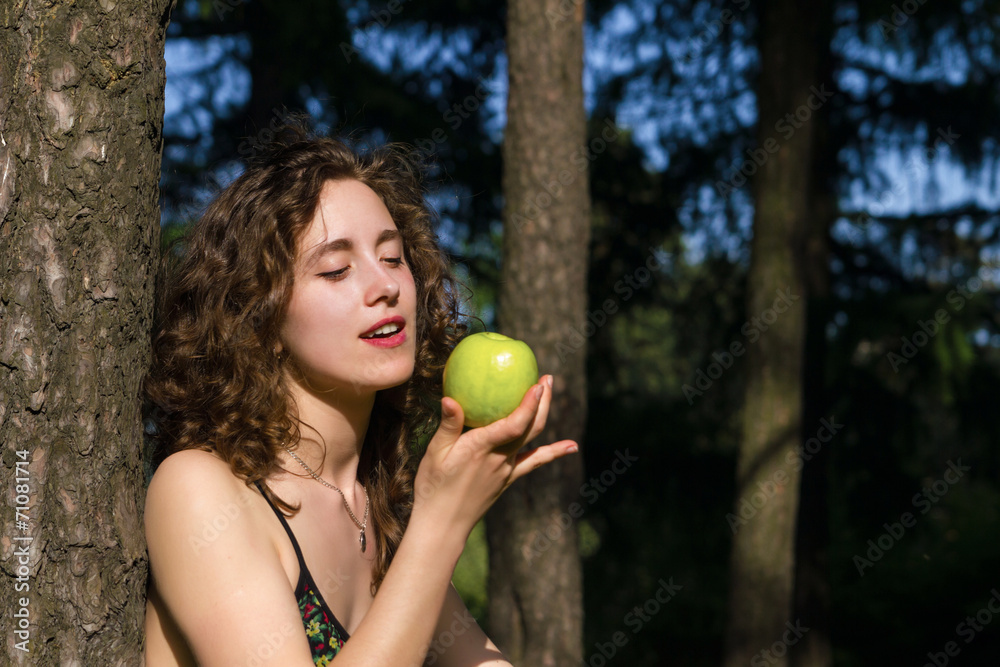 beautiful young woman eating apple outdoors beautiful young woman eating apple outdoors