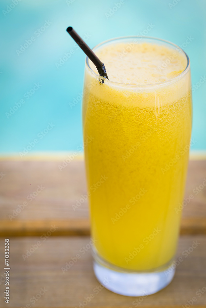 Fresh apple and orange juice on a wood Fresh apple and orange juice on a wood