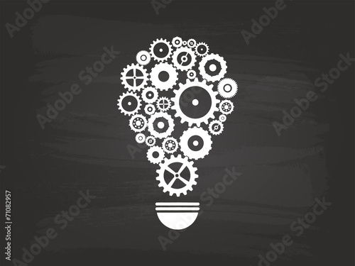Gears Light Bulb Idea Concept On Blackboard