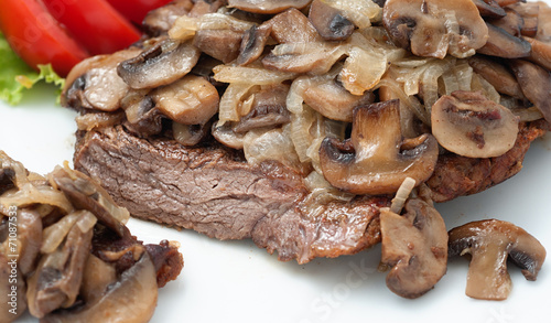 Fried beef with mushrooms and fresh tomatoes