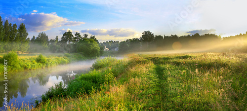 panorama of a summer landscape with sunrise, fog and the river