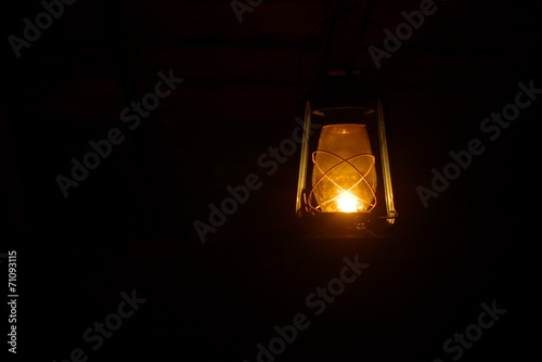 old lamp shine in the dark photo
