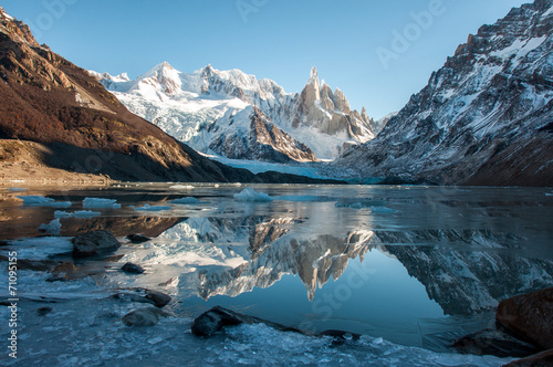 Frozen lake reflection at the Cerro Torre, Fitz Roy, Argentina photo