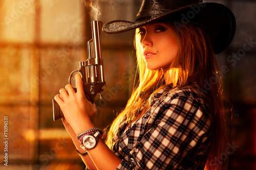 Young woman with gun