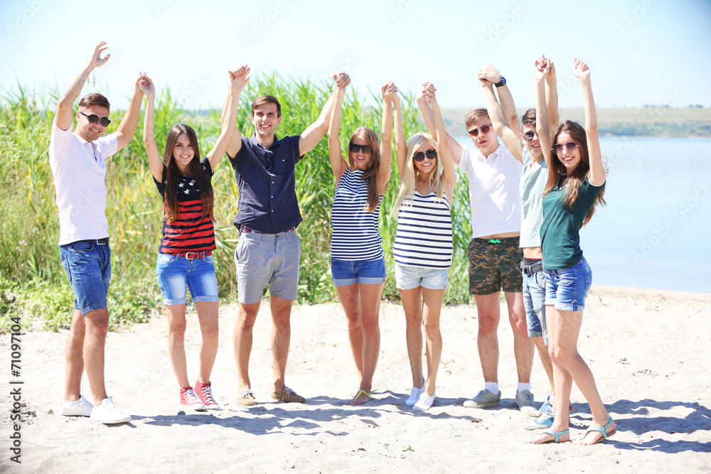 Obraz premium Beautiful young people on beach