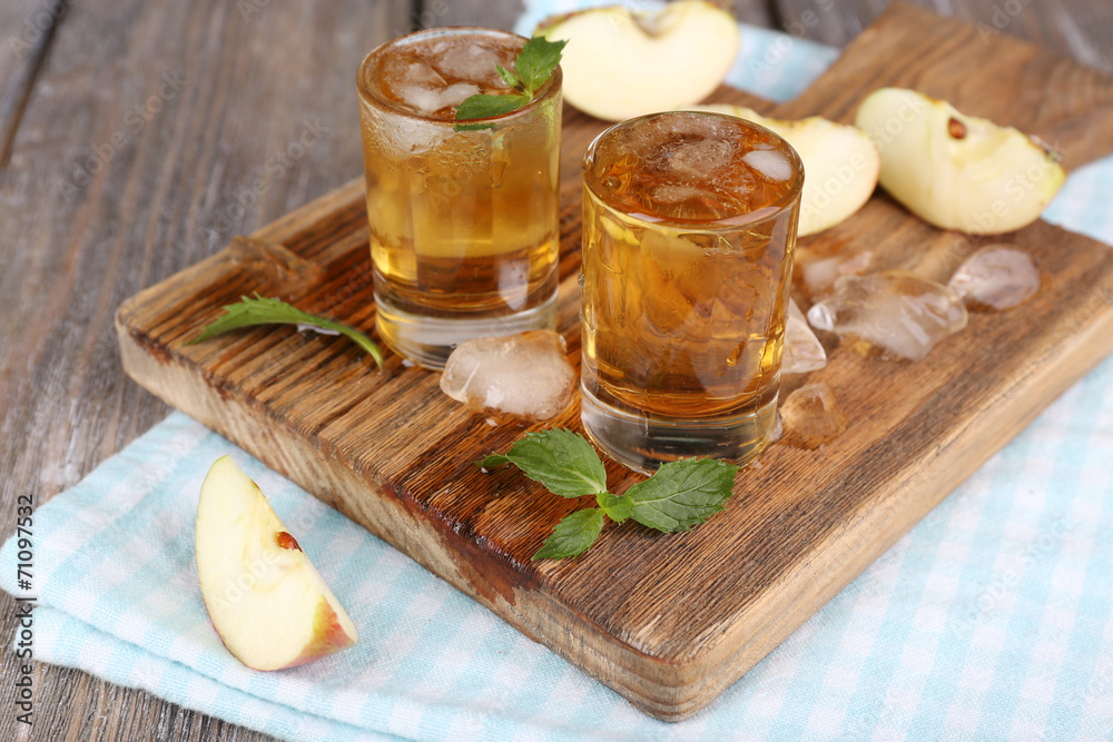 Still life with tasty apple cider in barrel and fresh apples Still life with tasty apple cider in barrel and fresh apples