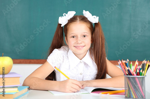 Cute girl at workplace in c...