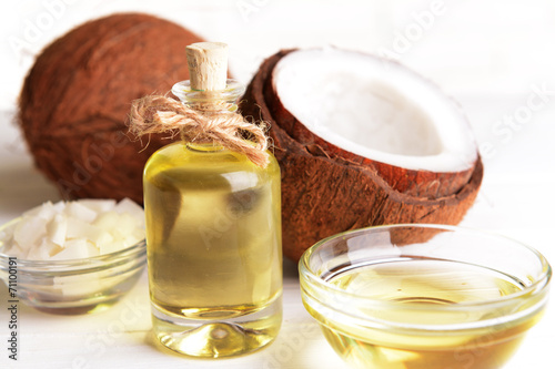 Coconut oil on table on light background