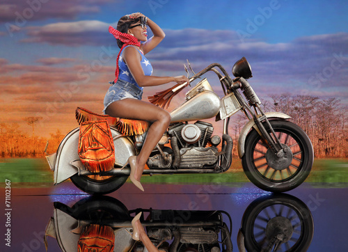 Fototapeta Naklejka Na Ścianę i Meble -  Fantasy ride - cute caribbean girl on a scale bike