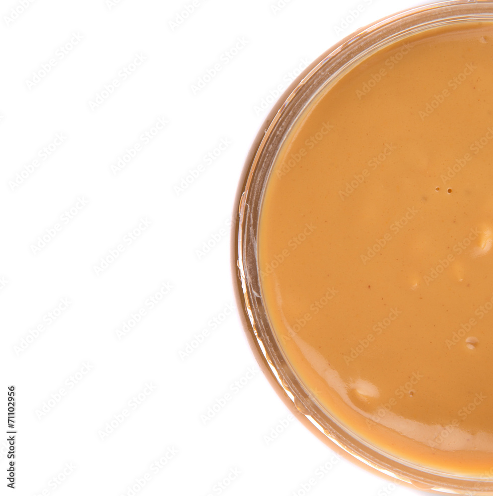 Peanut butter in a jar over white background Peanut butter in a jar over white background