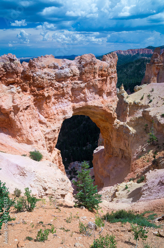 Rock Arch under thunder clouds at Bryce Canyon