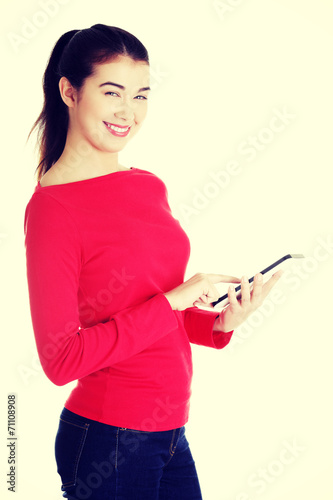 Young caucasian woman using tablet computer