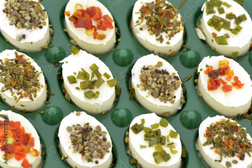 Close-up of cheese appetizers decorated on green