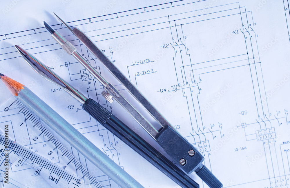 Compass and ruler lie on the drawing Compass and ruler lie on the drawing