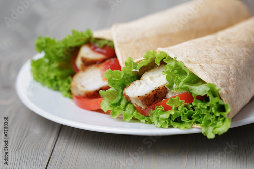 freshly made tortilla wraps with chicken and vegetables