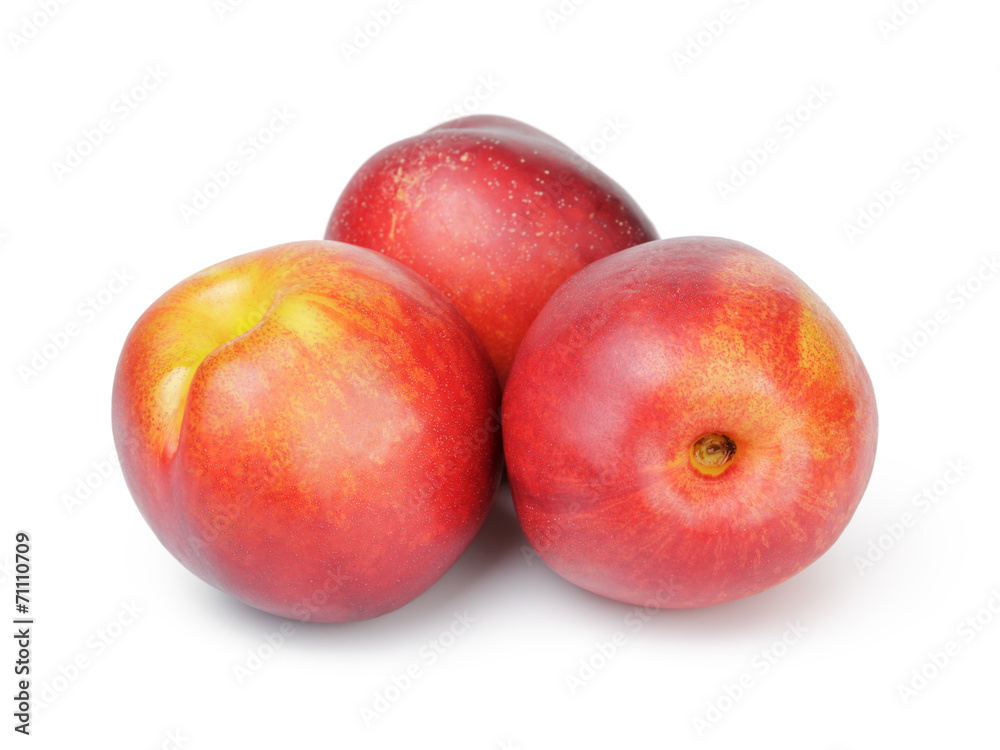three ripe whole nectarines three ripe whole nectarines