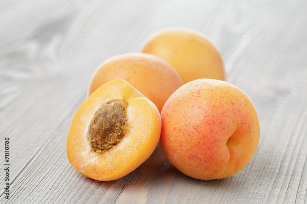 ripe juicy apricots on wooden table ripe juicy apricots on wooden table