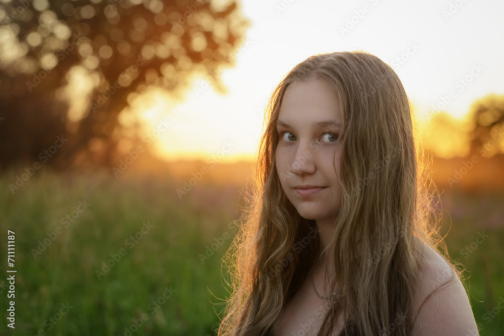 closeup portrait of teen girl in sunset