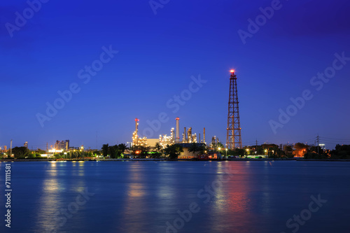Oil refinery at twilight with reflection