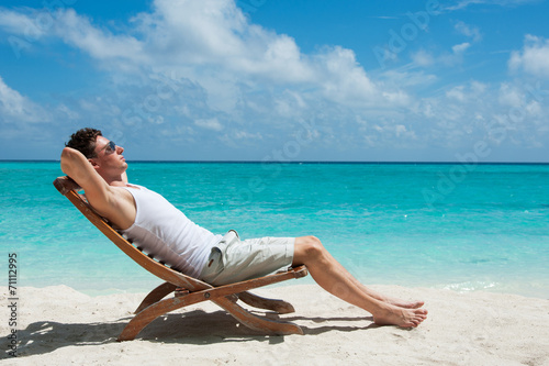 Man sunbathing on the beach