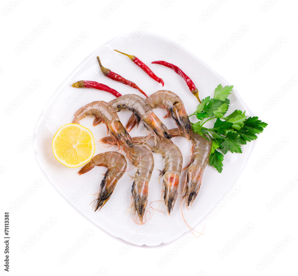 Raw tiger shrimps on plate.