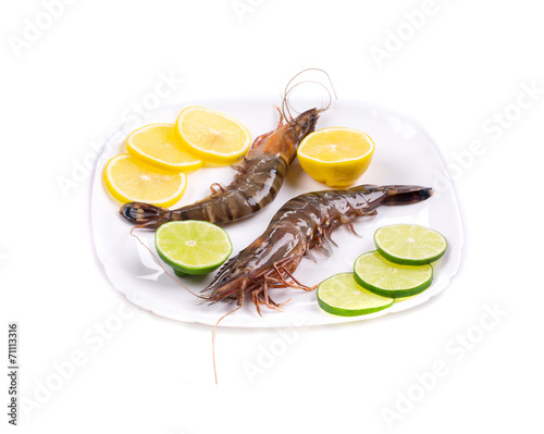 Raw tiger shrimps on plate.