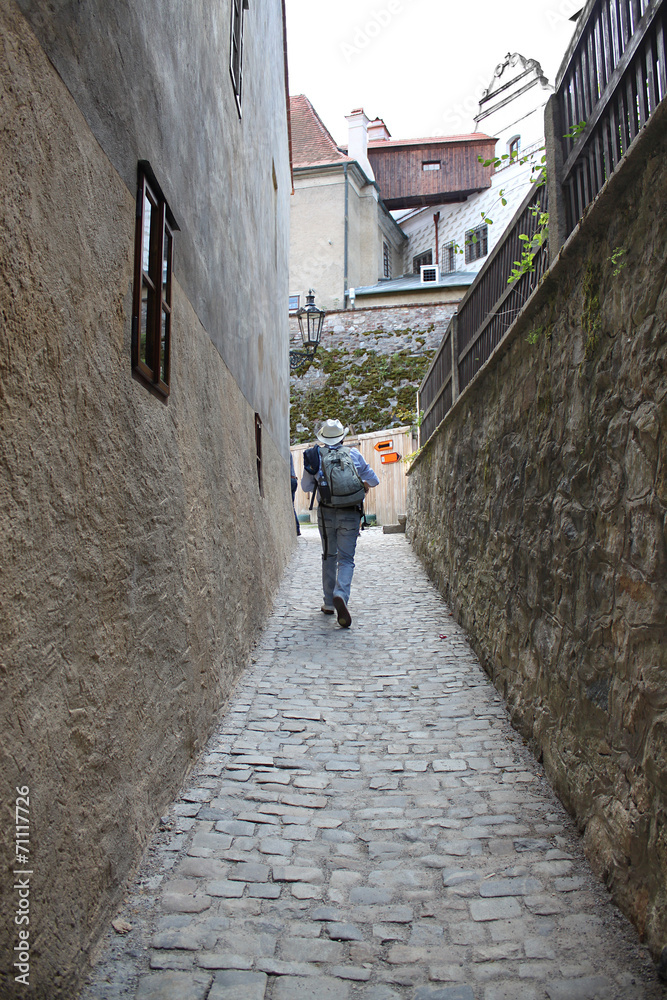 Hiker in Narrow Street