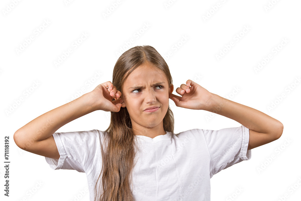 unhappy teenager girl covering plugging her ears looking up unhappy teenager girl covering plugging her ears looking up