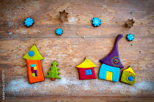 Sweet village. Colorful cookies on wooden background