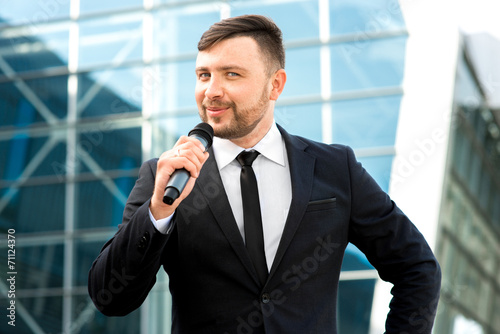 Portrait of well-dressed man on the contempopary background