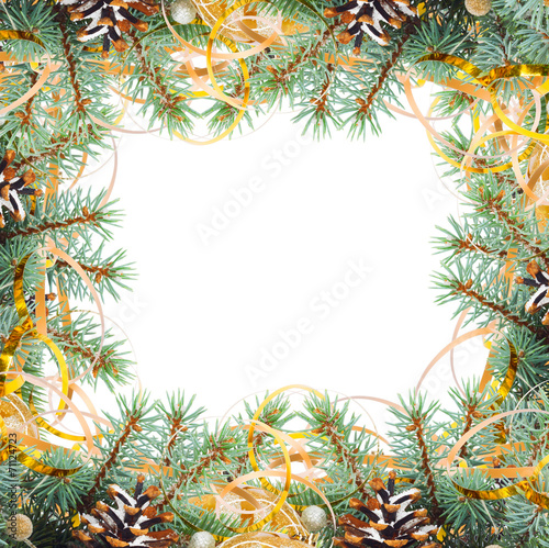 Christmas tree branch with gold serpentine and yellow sphere on