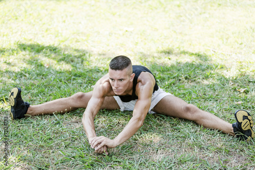 Fitness man exercising stretching