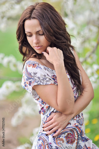 Beautiful young woman in the park. Outdoor portrait