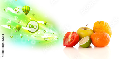 Colorful juicy fruits with green eco signs and icons
