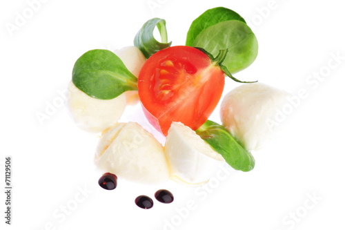 Caprese Salad. Tomato and Mozzarella slices with basil leaves #71129506