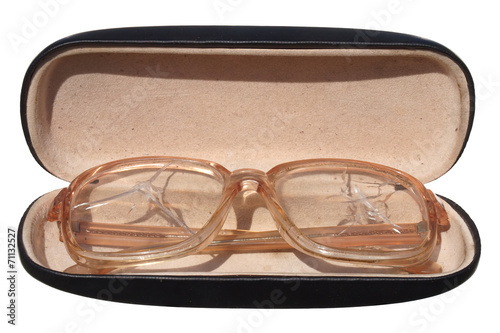 Old broken glasses in a case isolated on white background.