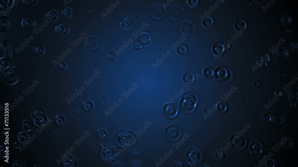 rain drops fall on the blue surface illuminated in the center. rain drops fall on the blue surface illuminated in the center.