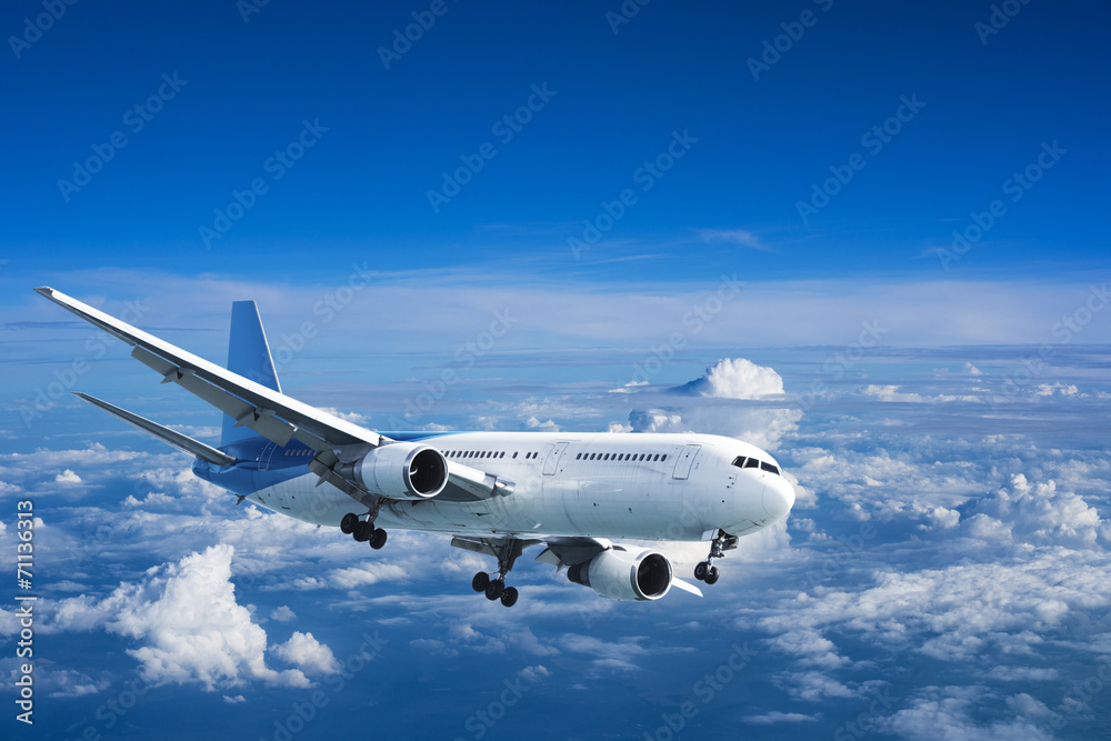 Obraz premium Jet aircraft above the clouds