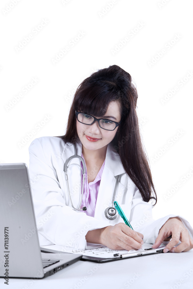 Female doctor making presciption isolated Female doctor making presciption isolated