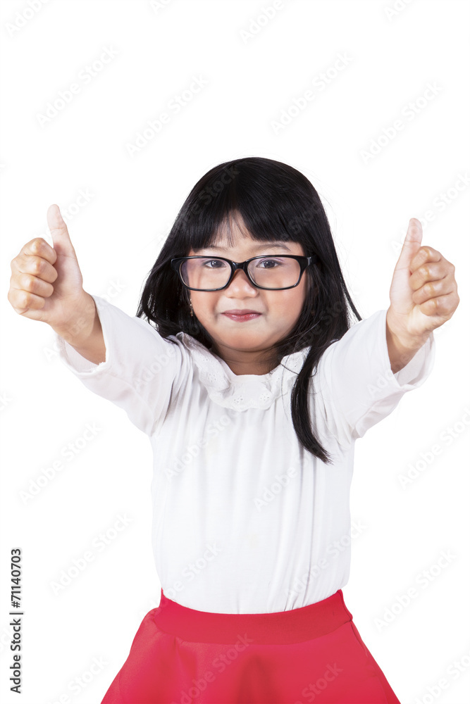 Little schoolgirl showing thumbs up Little schoolgirl showing thumbs up