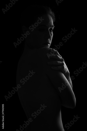 Body scape of woman back in low light emotion artistic conversio