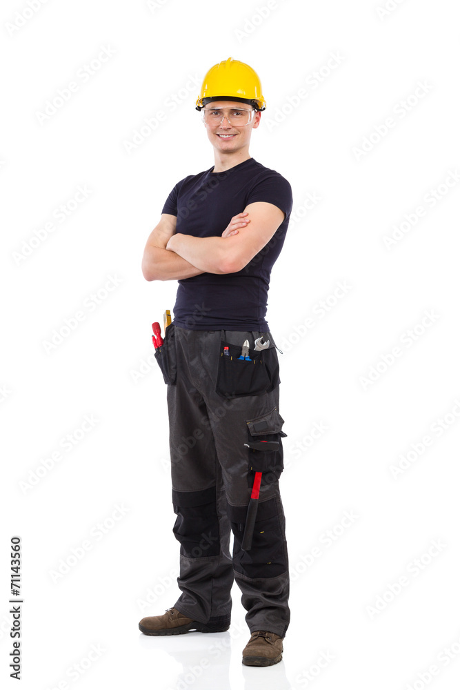 Mechanic in protective glasses and yellow hardhat Mechanic in protective glasses and yellow hardhat
