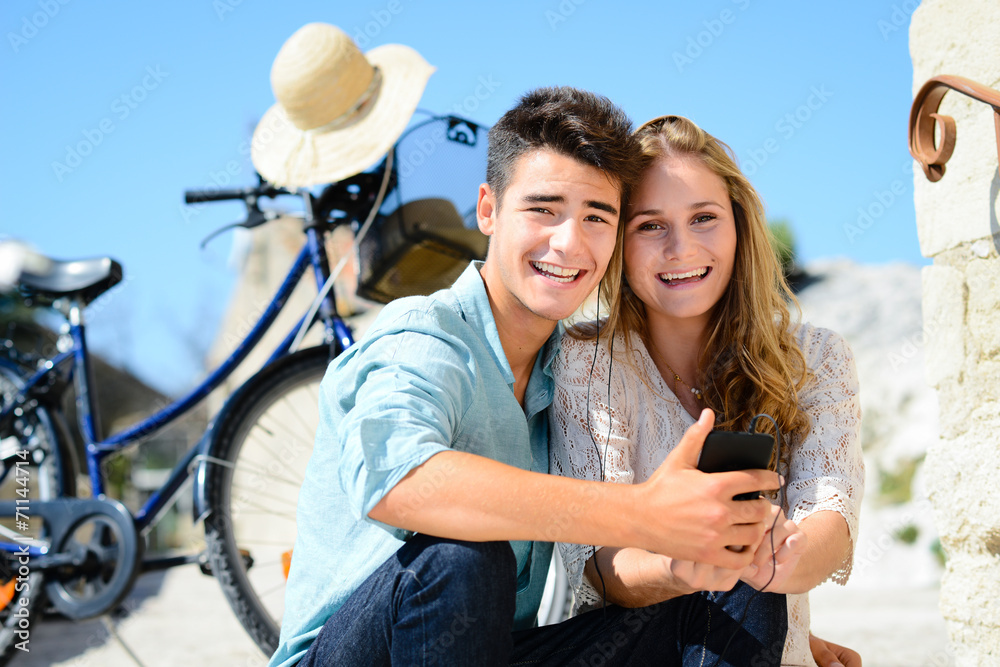 happy young couple of teenager first love together in summertime